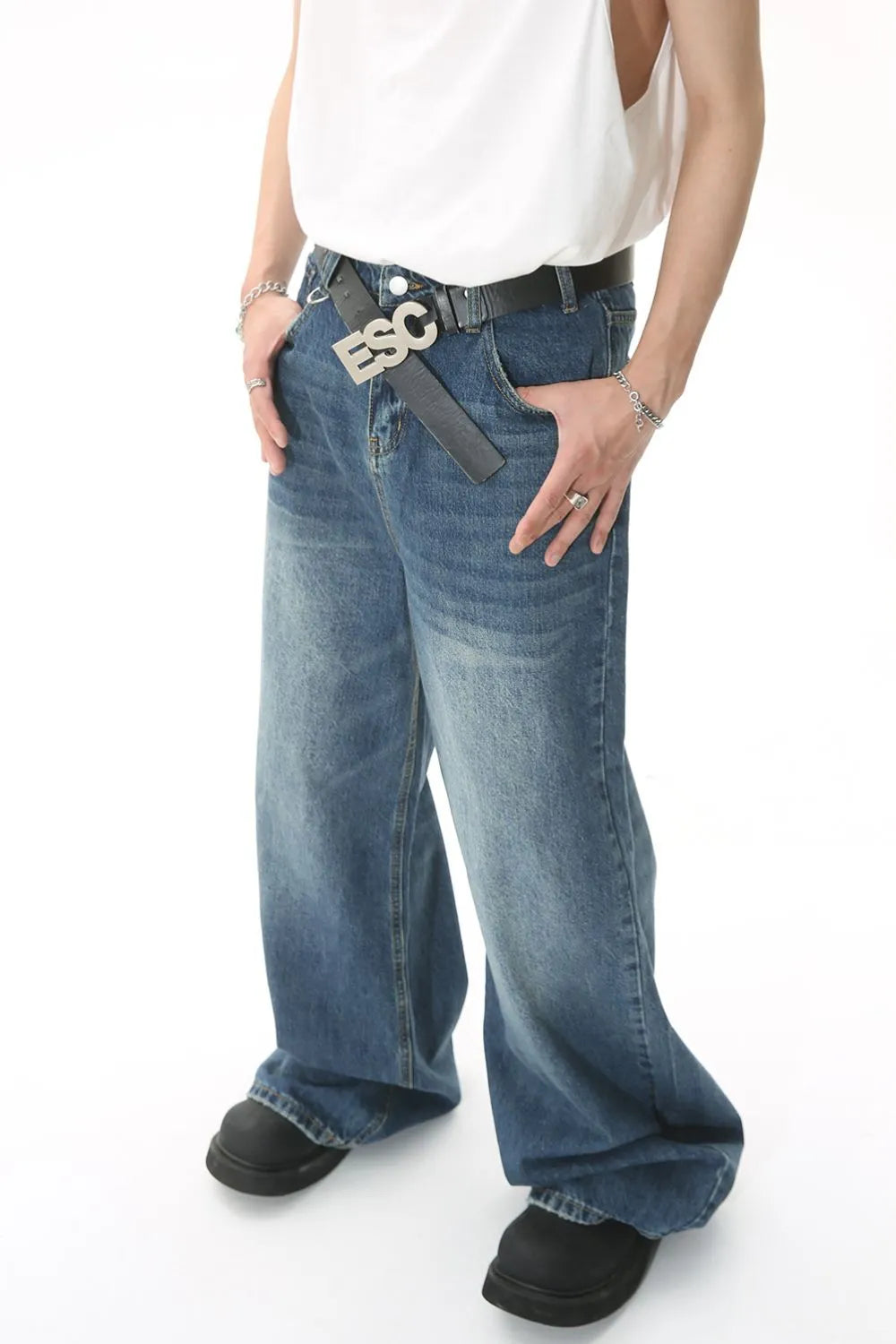 Light blue wide leg denim jeans with pockets from Plush Fashion Hub, featuring a relaxed fit and classic denim details.