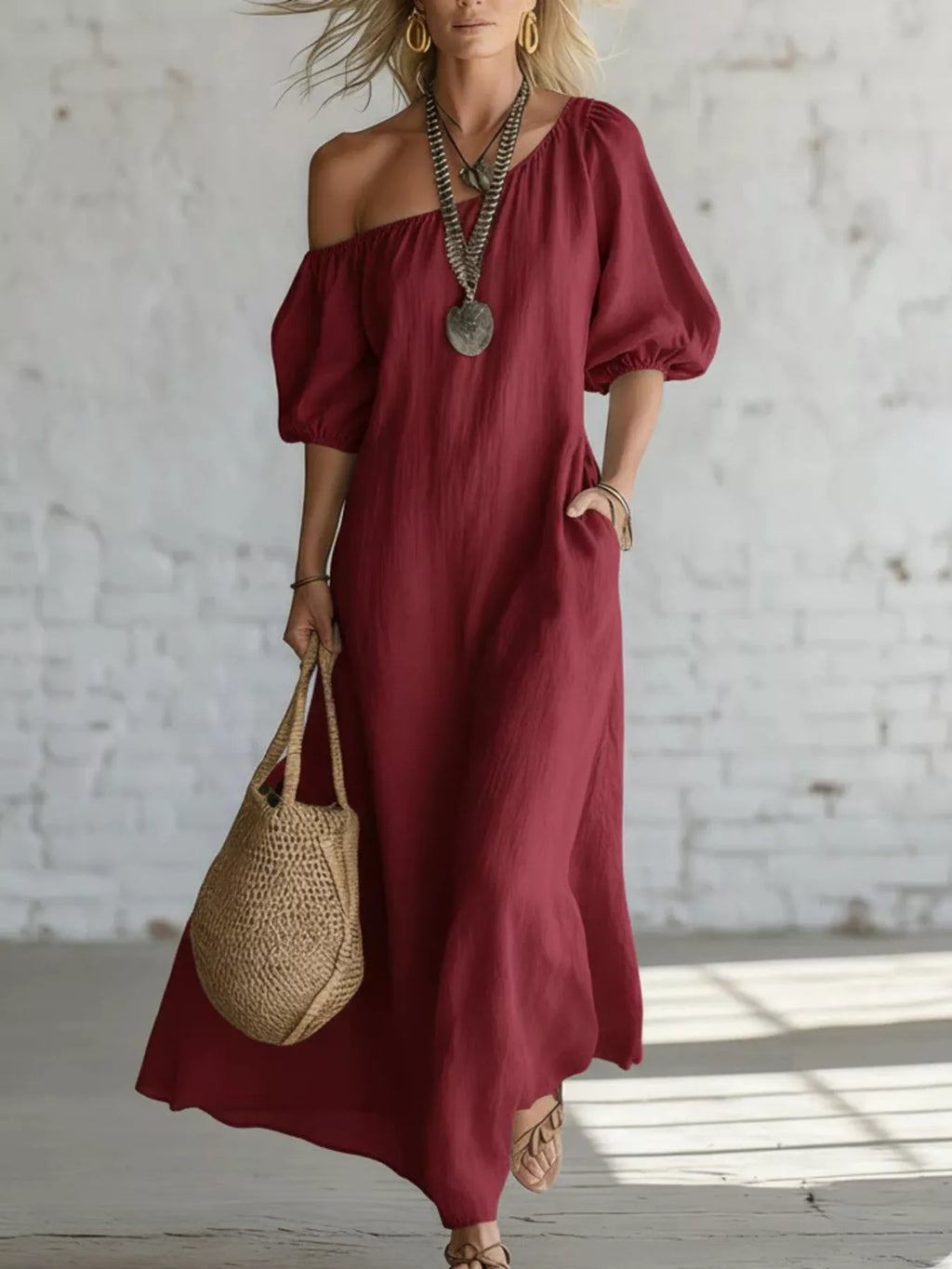One-shoulder puff sleeve maxi dress by Trendsi featuring a flowing silhouette and elegant design.