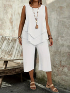 Casual sleeveless solid-colored top and cropped pants two-piece set by Plush Fashion Hub, shown on a model.