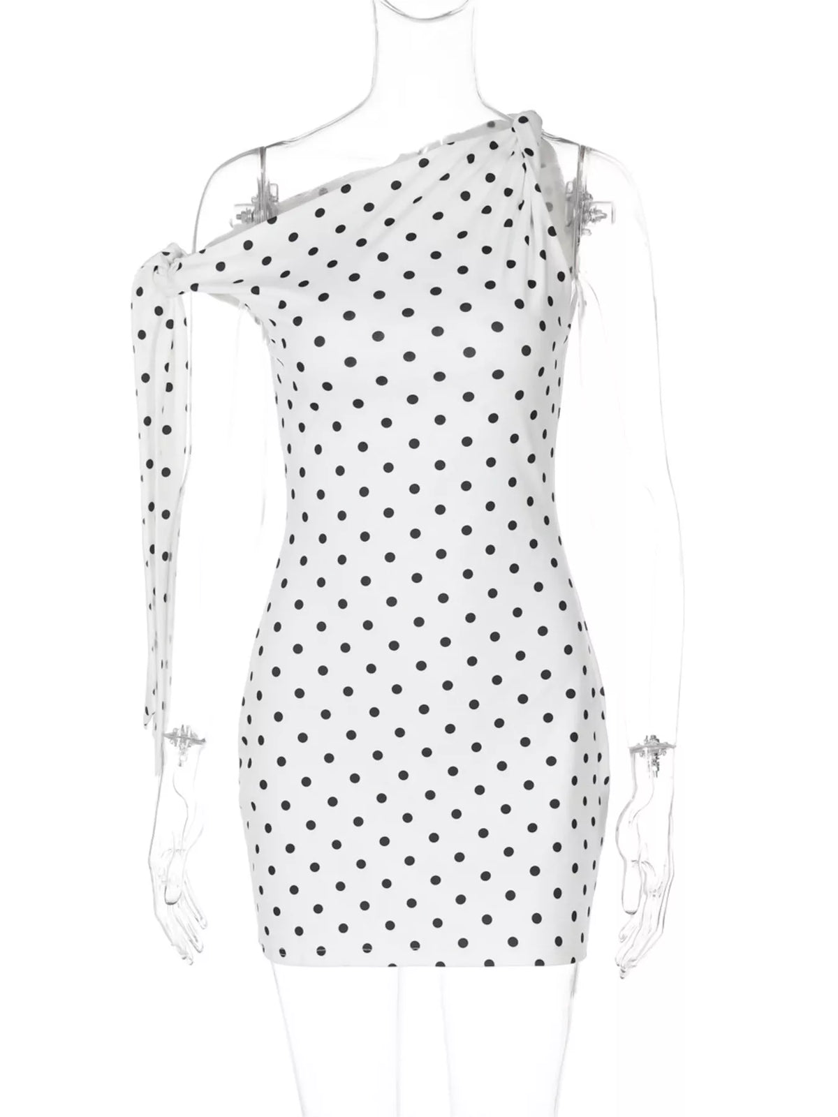 Polka dot sleeveless mini dress with bow accents by Plush Fashion Hub, showing the dress's playful pattern and stylish design.