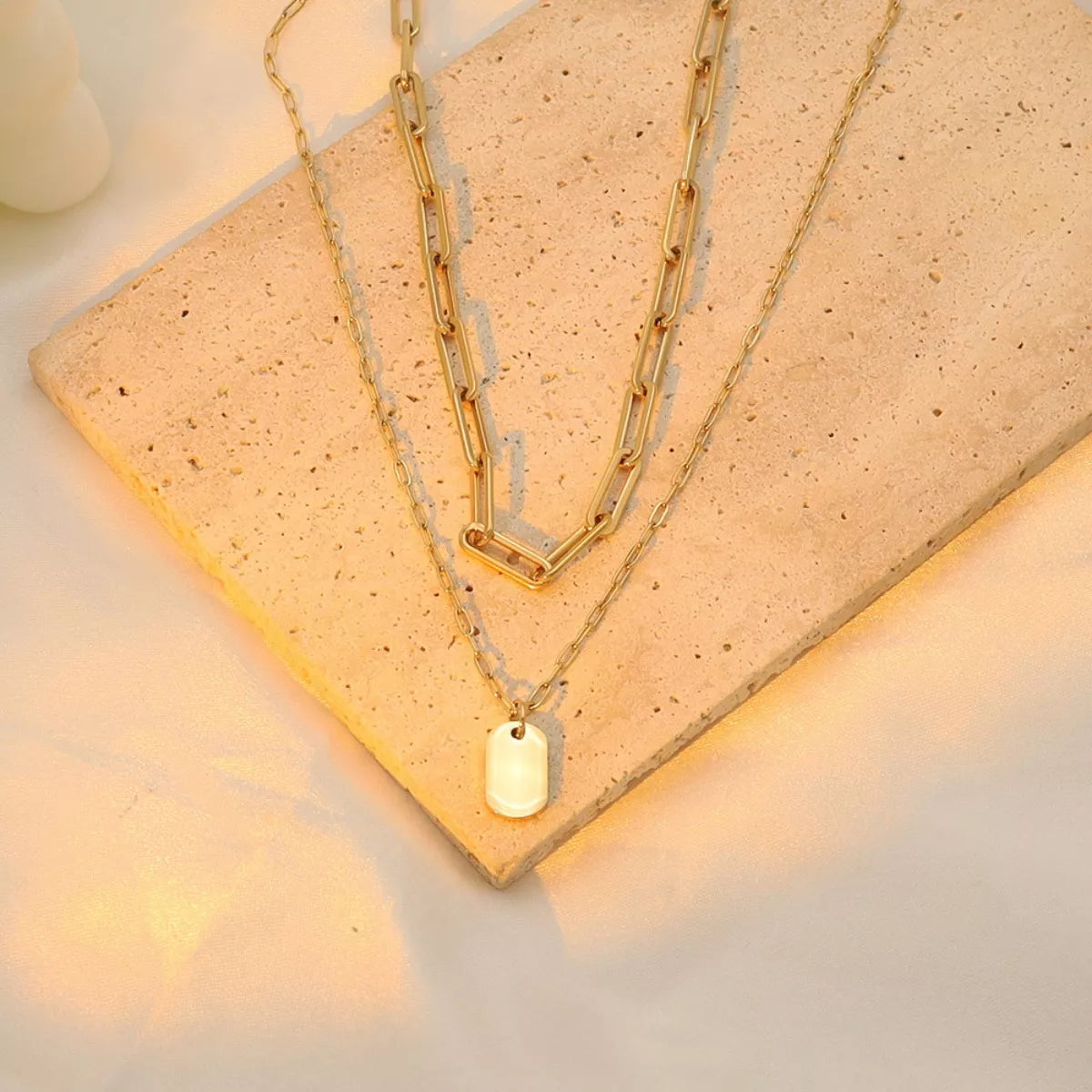 Gold-plated double layered necklace by Plush Fashion Hub featuring intricate chain designs and elegant style.