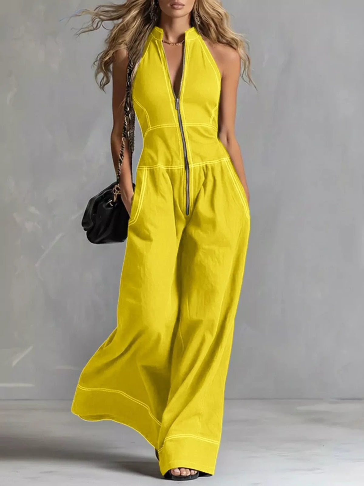 Sleeveless wide-leg jumpsuit with zip front from Trendsi, featuring a relaxed fit and stylish design.