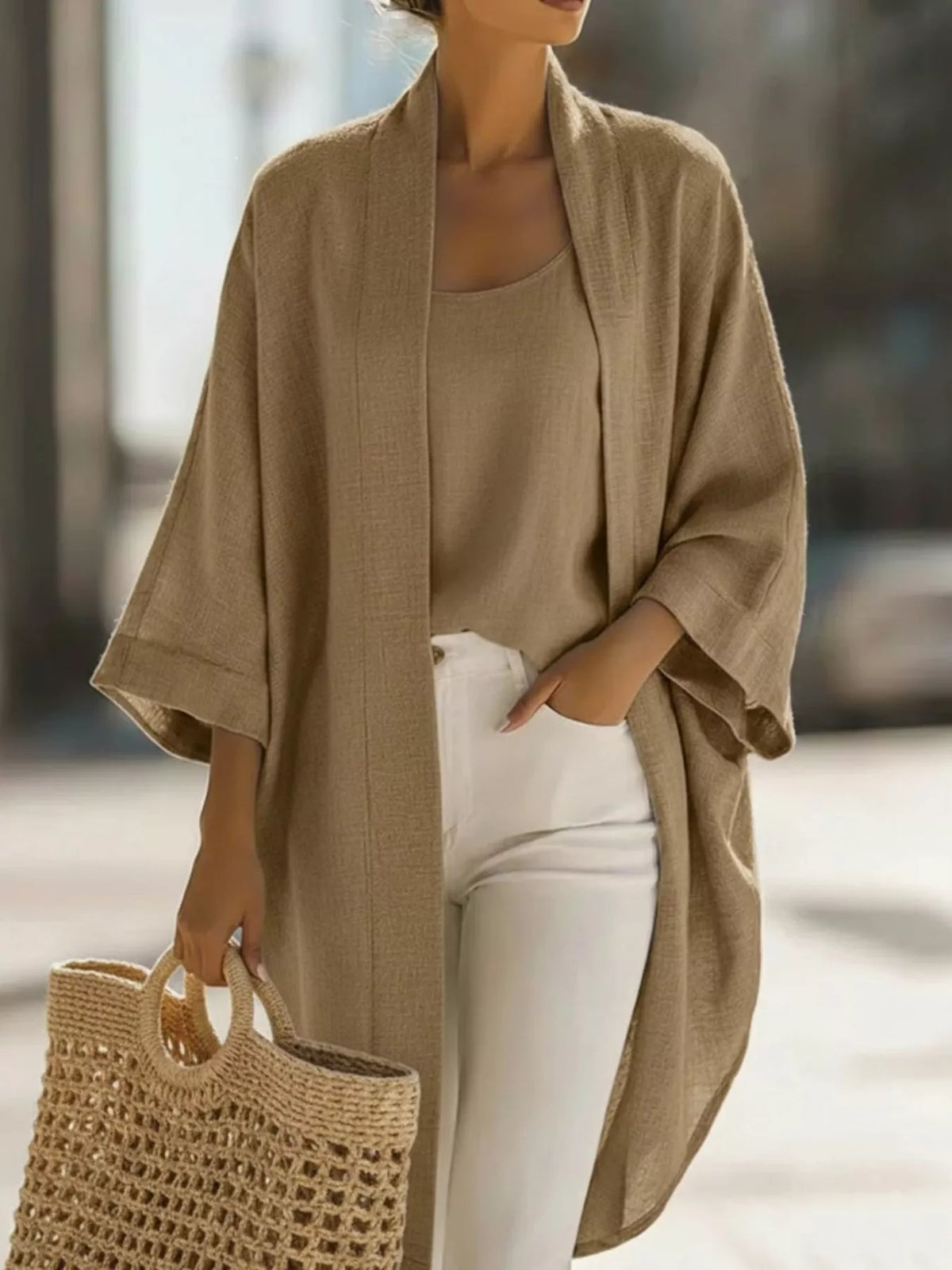 Plus size open-front cardigan and matching tank top set by Trendsi, featuring a cozy, stylish layered look.