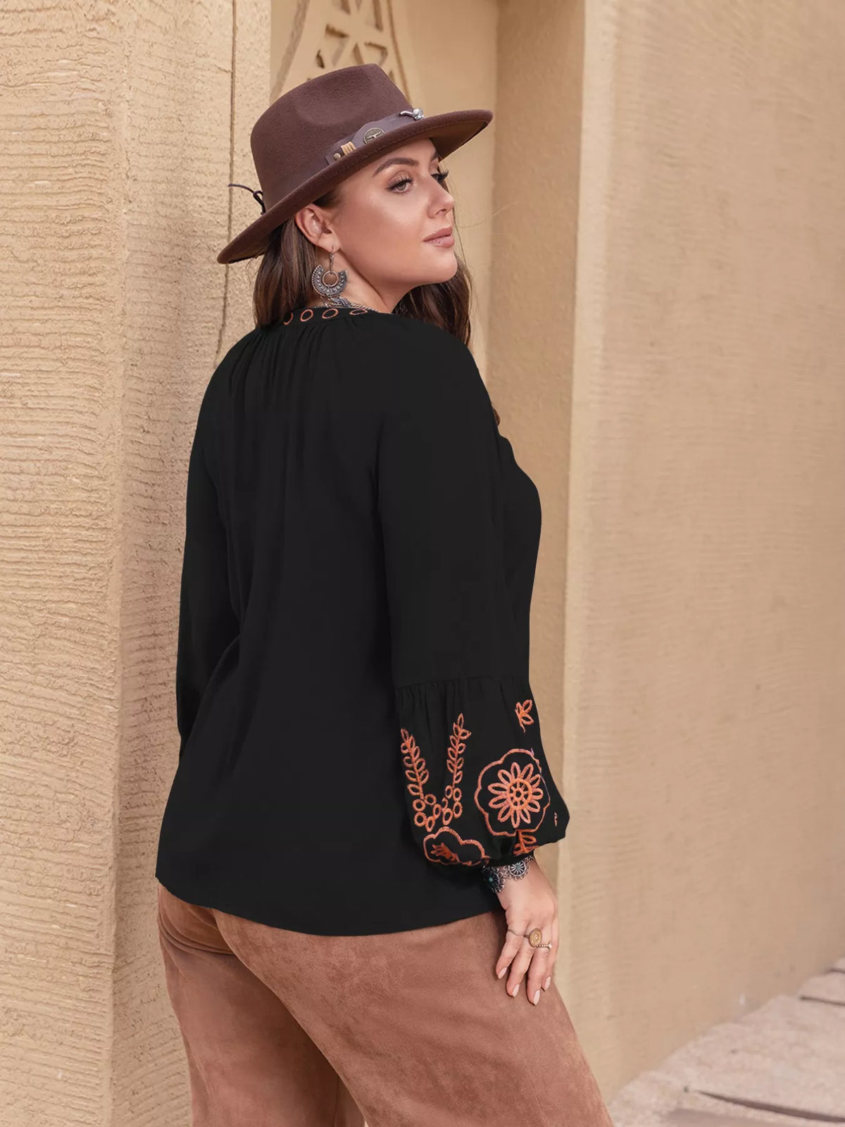 Plus size boho embroidered long sleeve blouse by Simply Love featuring colorful embroidery and relaxed fit, displayed on a hanger.