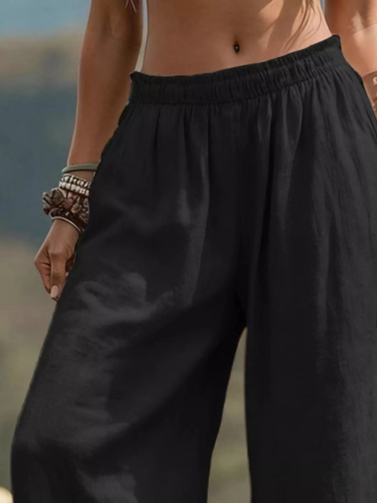Bohemian wide-leg pants for full size and plus size, flowing fabric and relaxed fit, styled with a casual top.