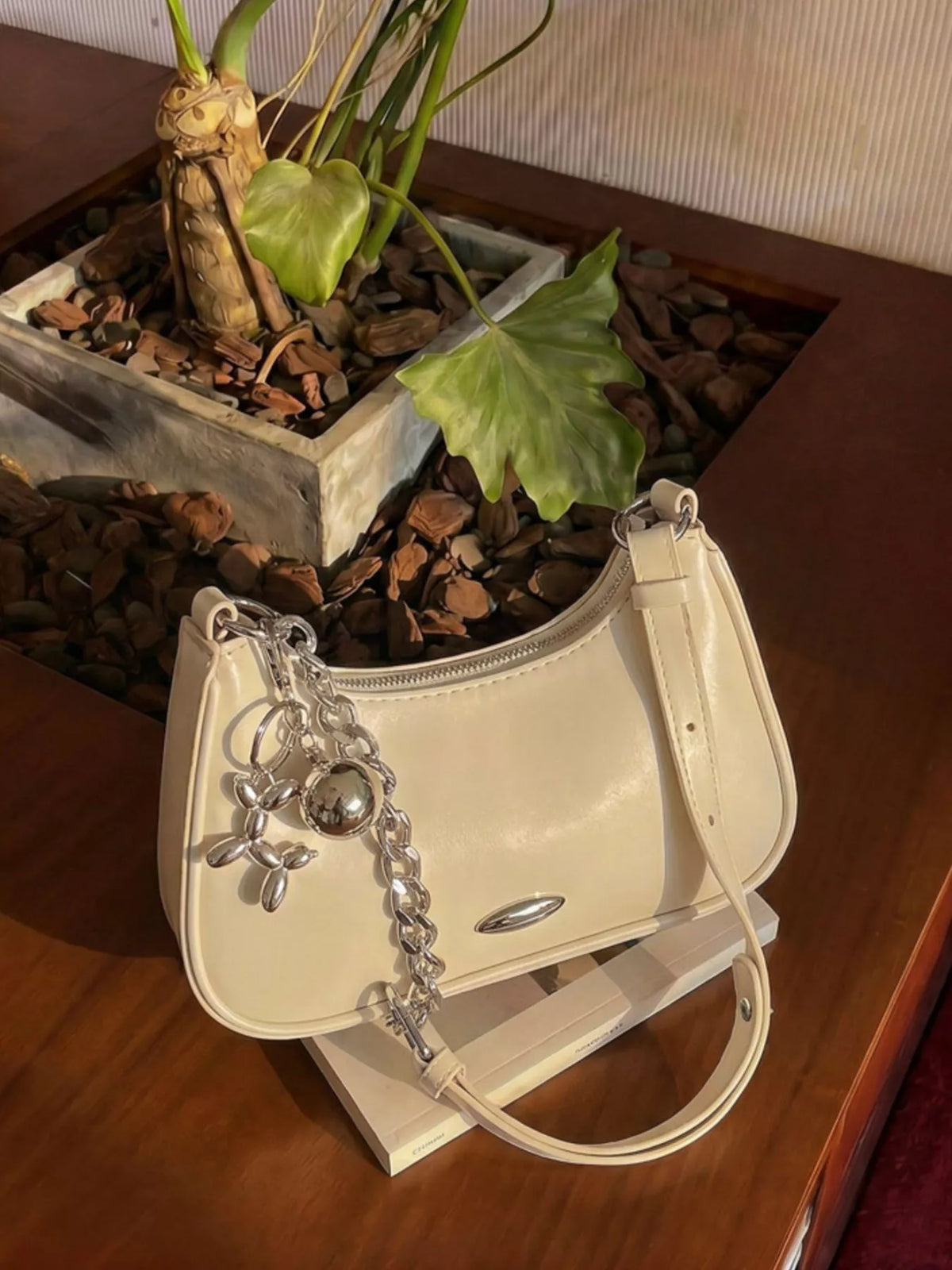 Trendsi PU leather shoulder handbag with a sleek design, featuring a spacious interior and stylish shoulder strap.