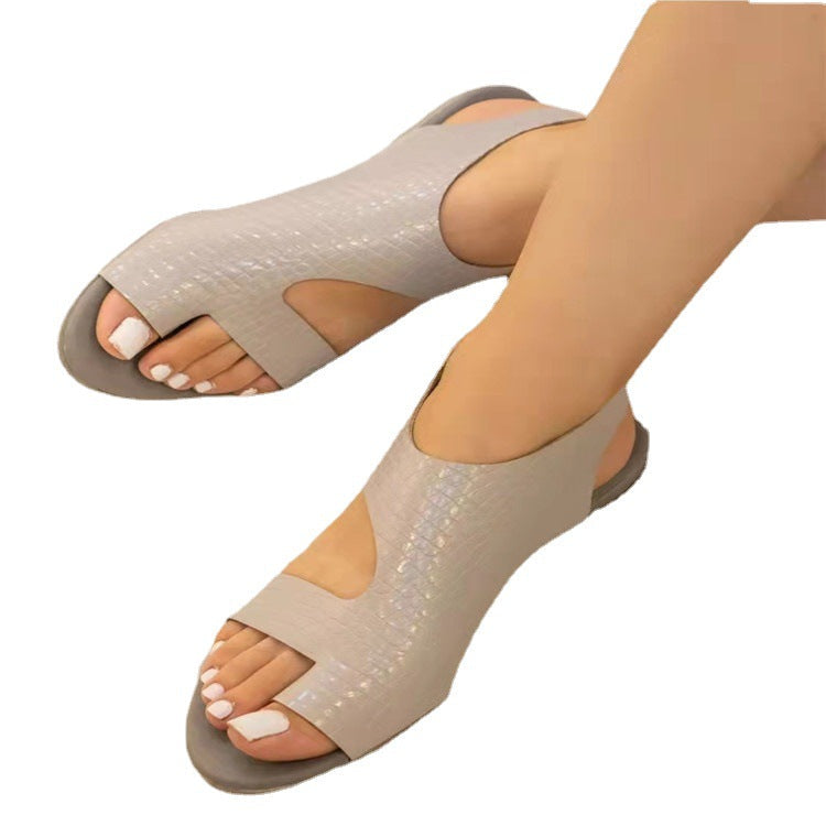 LadyShow.Store summer ladies casual flat plus size beach resort sandals with open toes and comfortable straps on a sandy background.