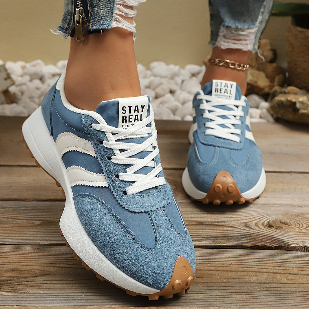 Women's round toe lace-up flat casual sneakers by Trendsi, made of comfortable PU leather with a sleek, everyday style.