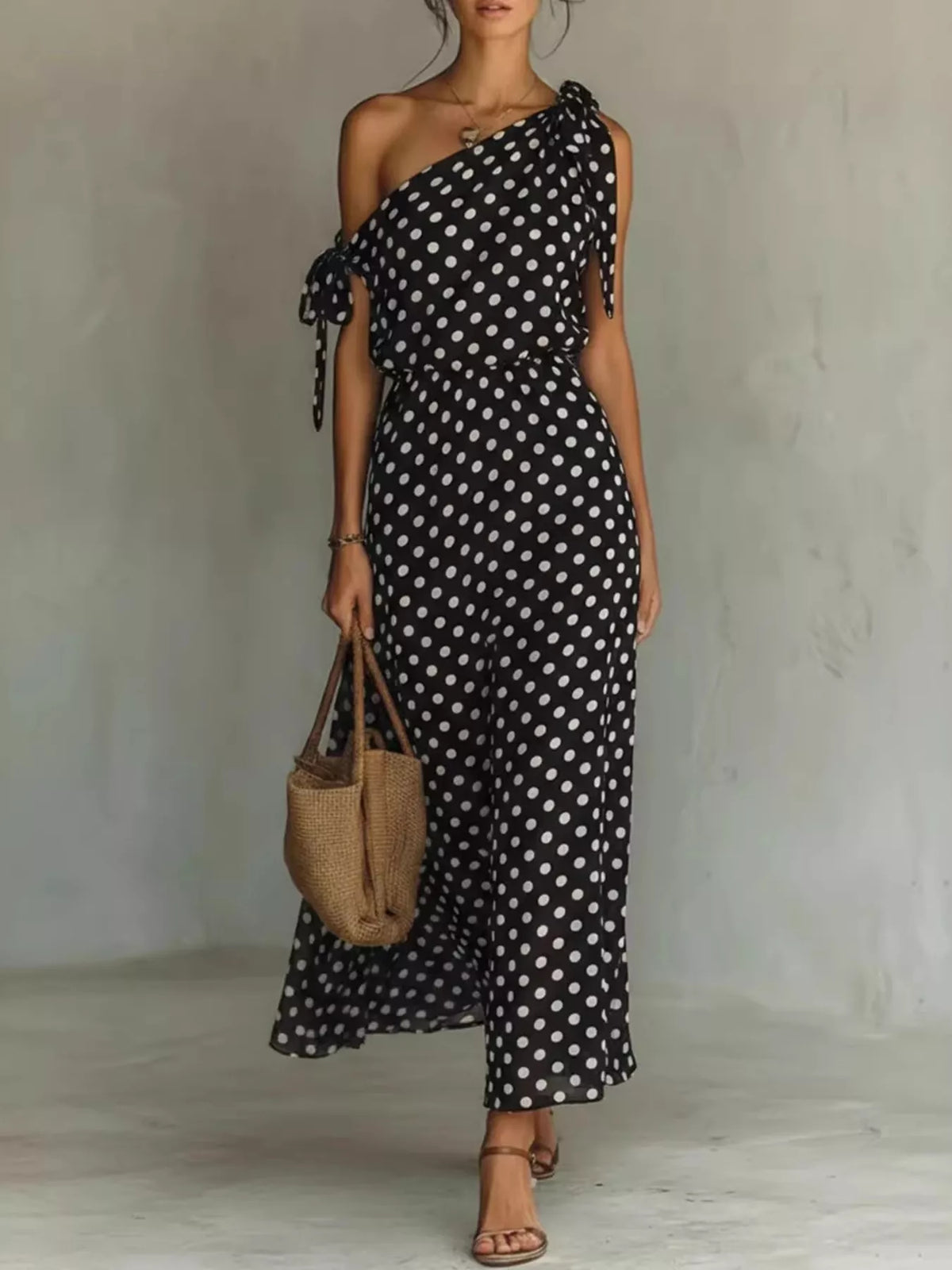 Plus size polka dot one-shoulder maxi dress by Plush Fashion Hub, featuring a flowing full-length design with a stylish one-shoulder neckline.