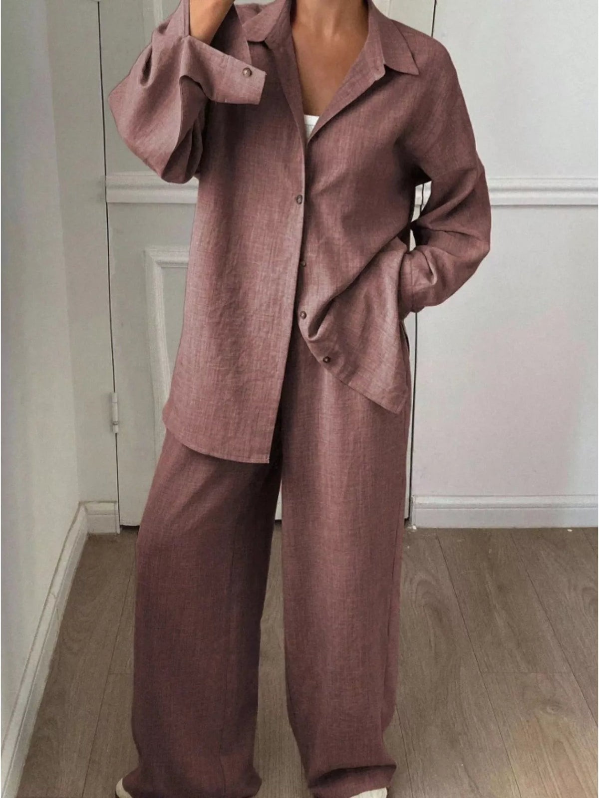 Trendsi long sleeve button-up shirt and wide-leg pants set, stylish casual outfit with button details and relaxed fit.