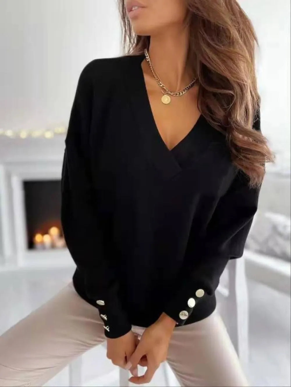 V-neck long sleeve sweatshirt from Trendsi in soft fabric, featuring a relaxed fit and subtle neckline detail.
