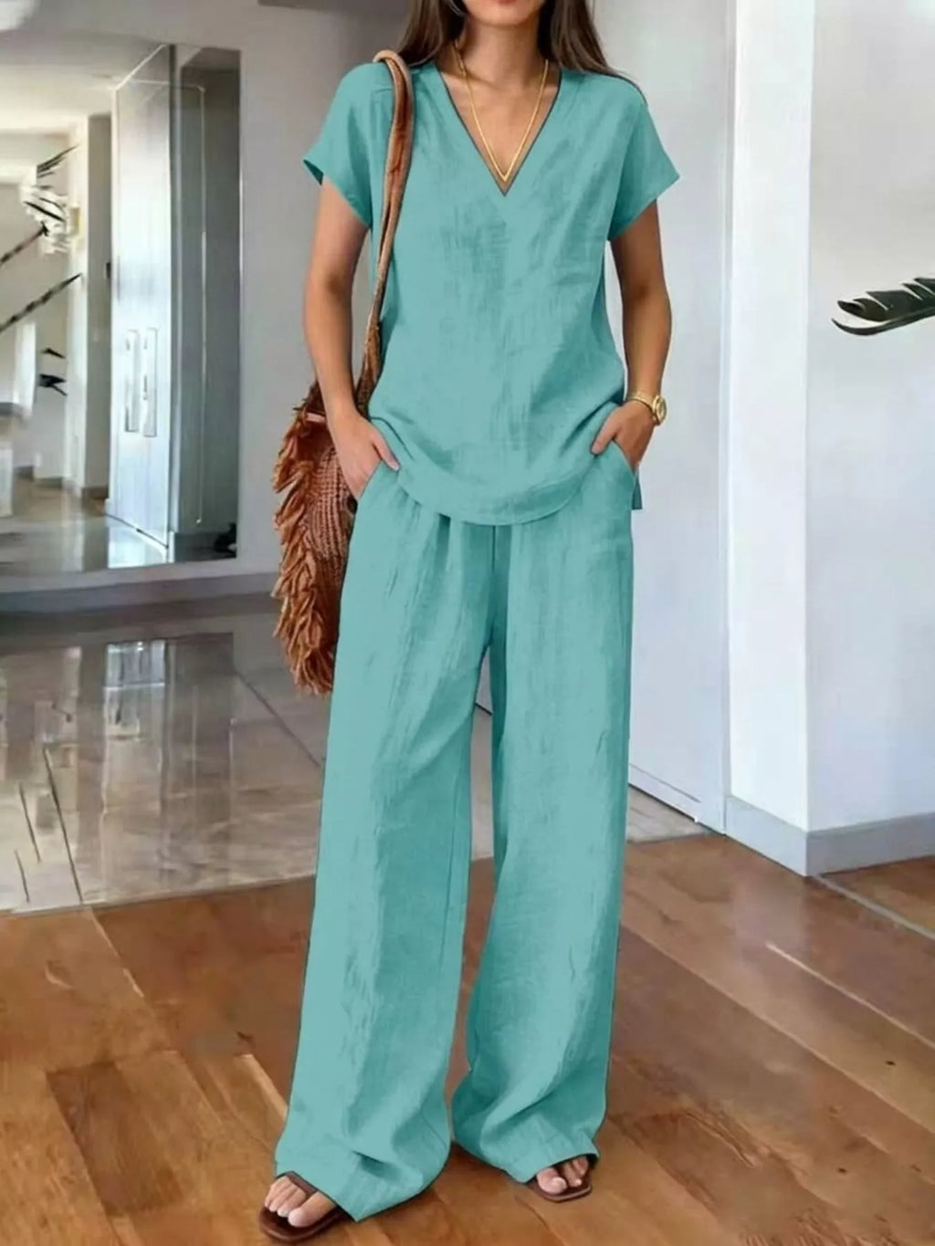 Plus size Trendsi loungewear set featuring a V-neck short sleeve top and matching pants, comfortable and casual for relaxed wear.