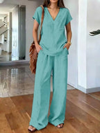 Plus size Trendsi loungewear set featuring a V-neck short sleeve top and matching pants, comfortable and casual for relaxed wear.