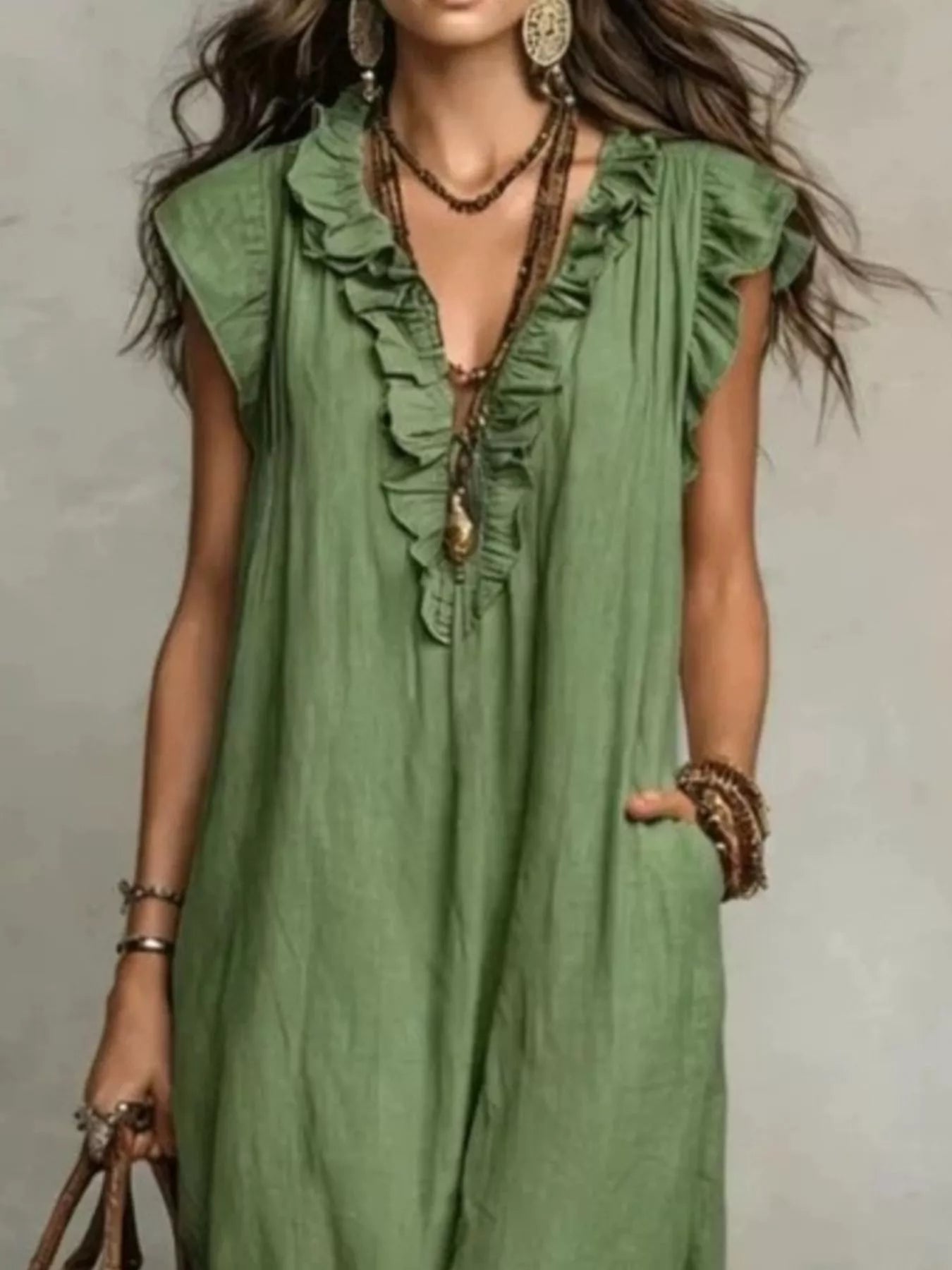 Plus size ruffled v-neck cap sleeve maxi dress by Trendsi, featuring a full-length flowy design with layered ruffles.