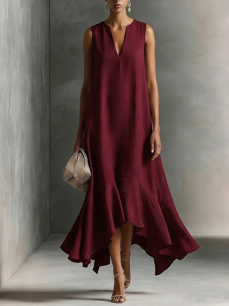 Women's deep V-neck sleeveless asymmetrical maxi dress with patchwork design by FitiqueFit, flowing style with unique hem detail.