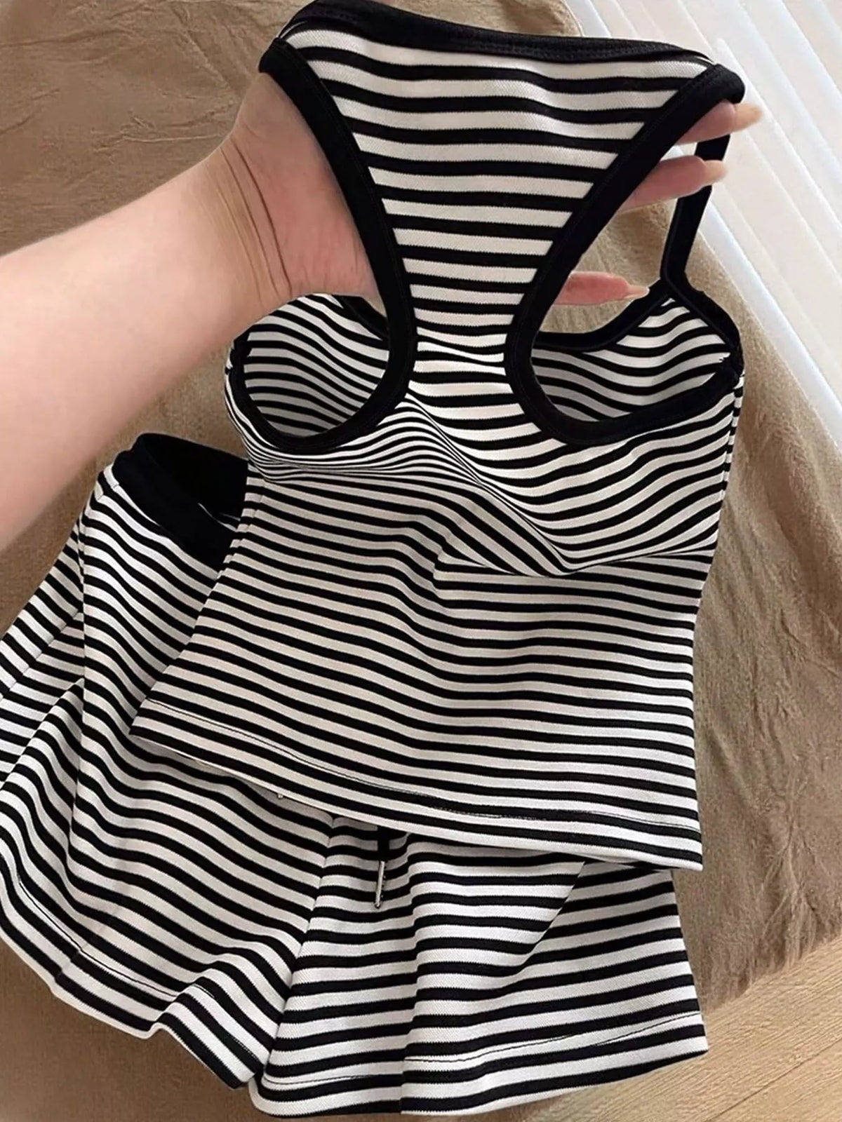 Striped tank top and shorts set from Plush Fashion Hub, featuring a casual summer look with comfortable fabric and stylish design.