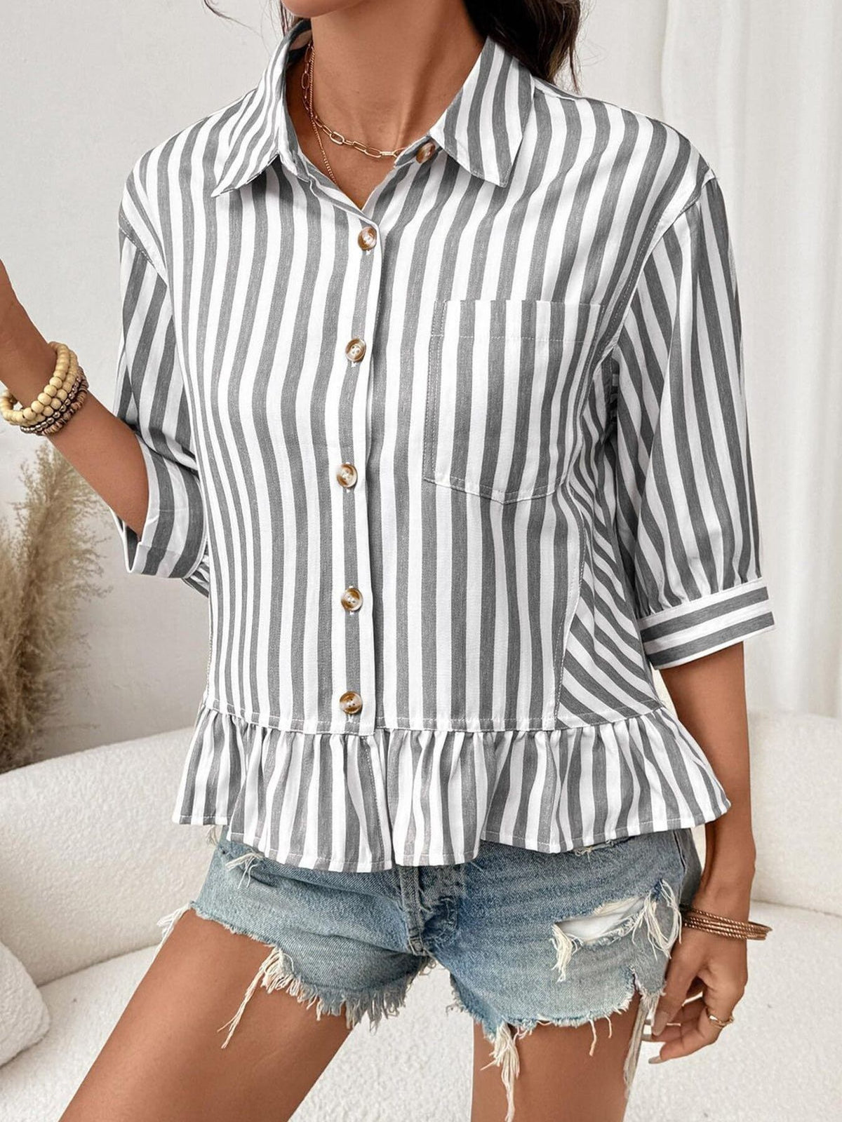 Women’s striped button-down blouse by Plush Fashion Hub featuring lightweight viscose fabric and a ruffled hem.