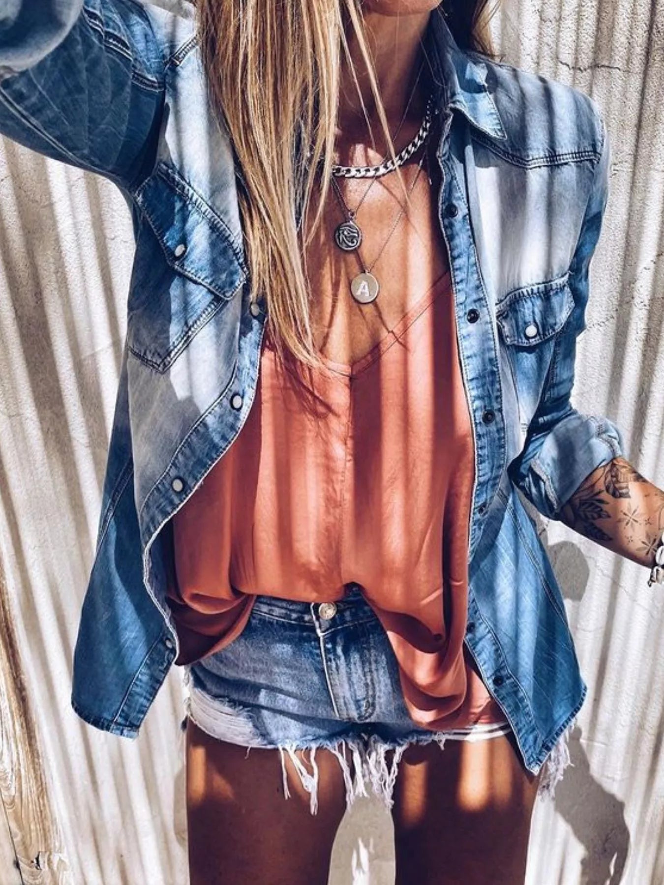 Vintage wash denim button-up shirt from Plush Fashion Hub, featuring classic collar and long sleeves, casual top for everyday wear.