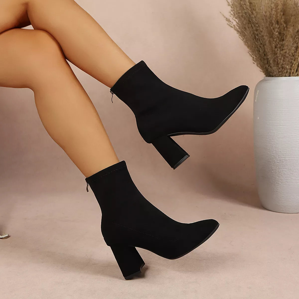 Women’s point toe block heel ankle boots by Trendsi, featuring sleek design and stylish ankle height with sturdy block heels.