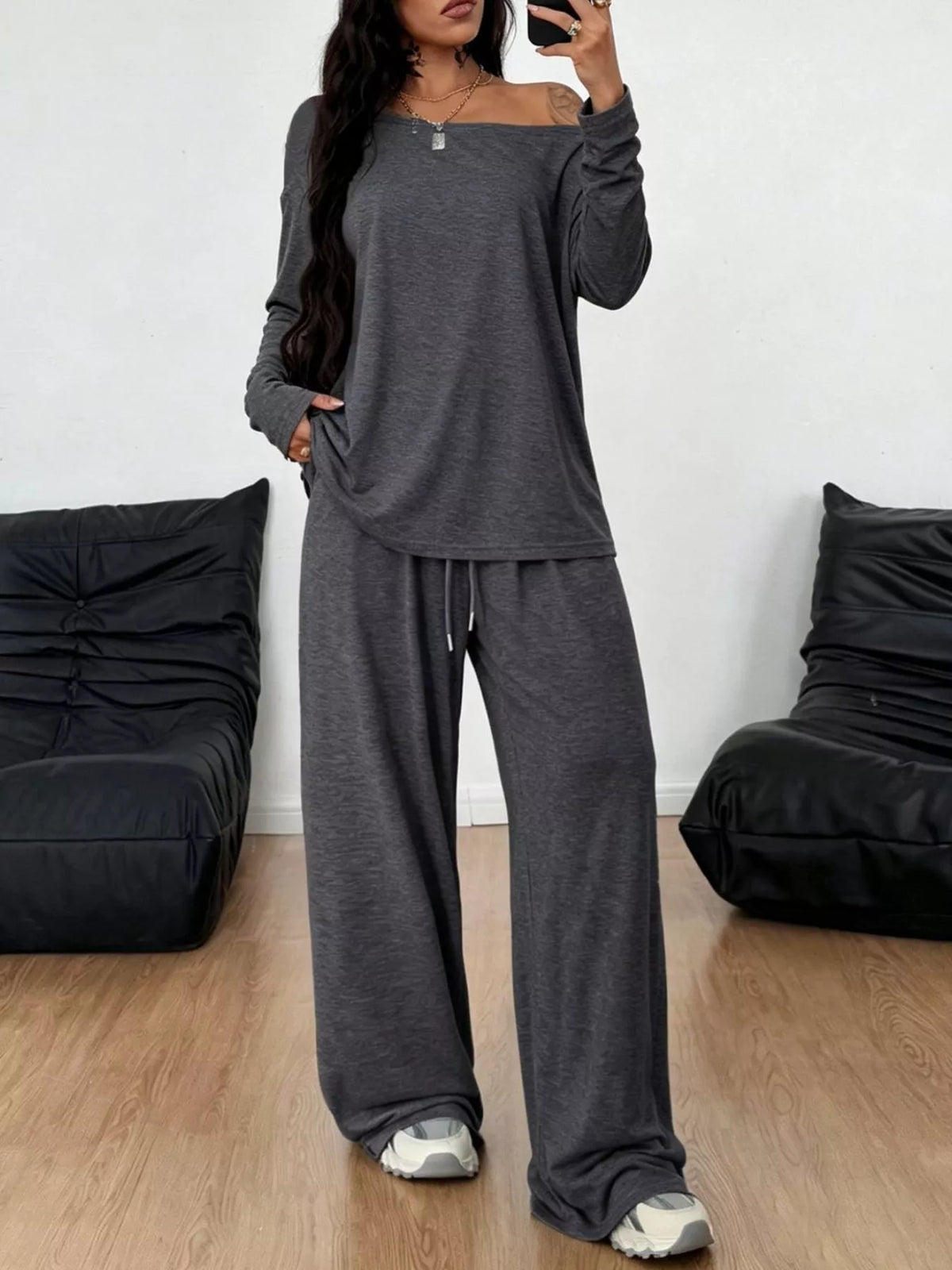 Plus size loose fit one-shoulder t-shirt and pants set by Trendsi, casual matching outfit with relaxed style in neutral tones.