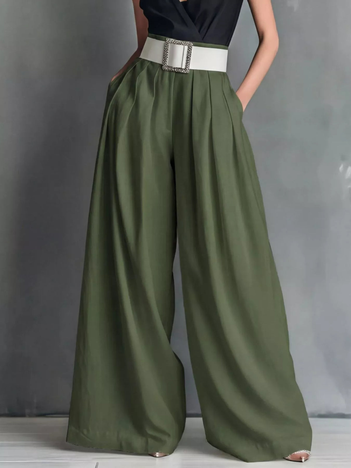High-waisted wide-leg pants by Plush Fashion Hub, shown in a neutral color, with a relaxed fit and flowing silhouette.