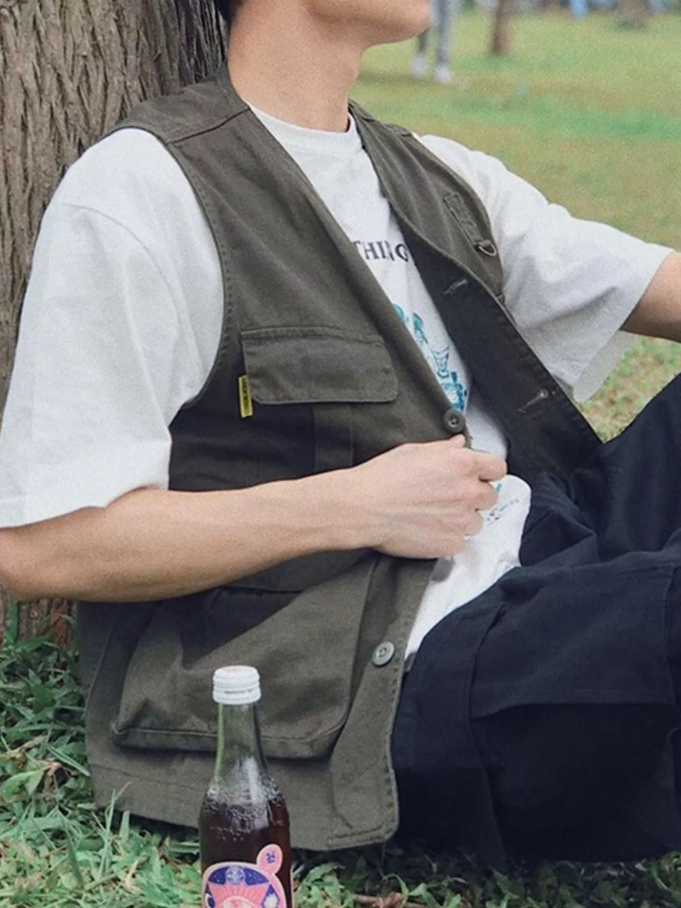 Men's multi-pocket cargo vest from Trendsi with multiple front pockets and adjustable straps, shown in a neutral color.