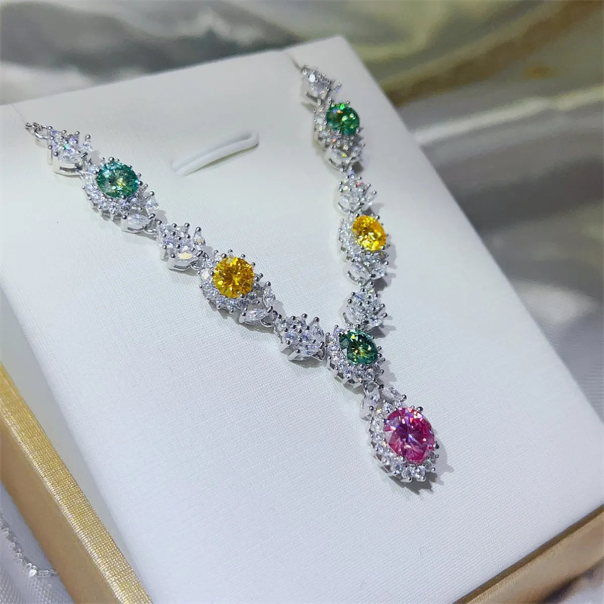 Sterling silver necklace with a 3.5 carat moissanite gemstone, featuring a delicate chain and sparkling pendant.