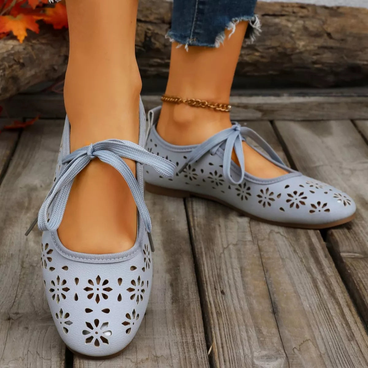 Floral cutout tied slip-on sandals by Plush Fashion Hub featuring open toes and floral design for casual summer wear.