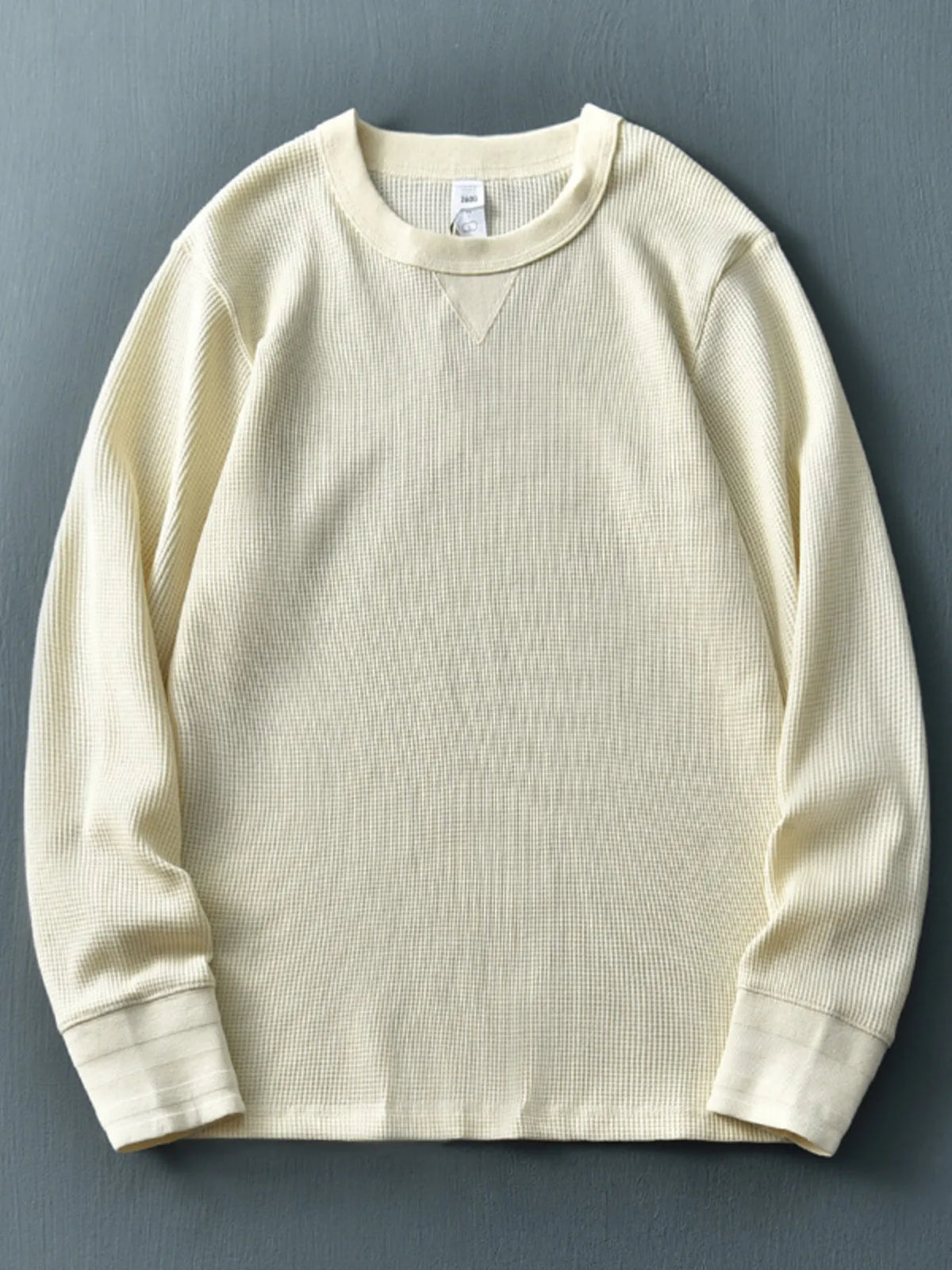 Men's plus size round neck long sleeve T-shirt by Trendsi, in a comfortable fit, shown on a model with a neutral background.