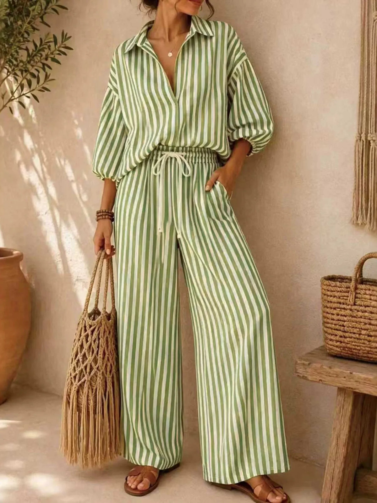 Plus size striped puff sleeve shirt and wide-leg drawstring pants set, trendy matching outfit by Trendsi with comfortable style
