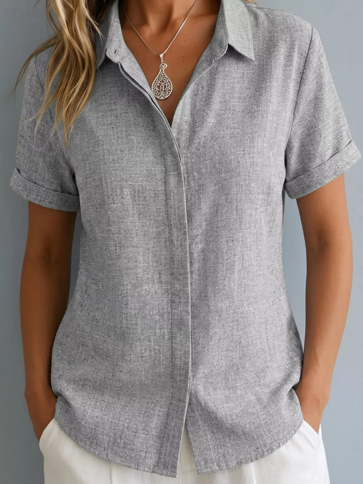 Plus size collared short sleeve shirt from Trendsi, featuring a classic design and full-size fit, shown in a stylish top image.