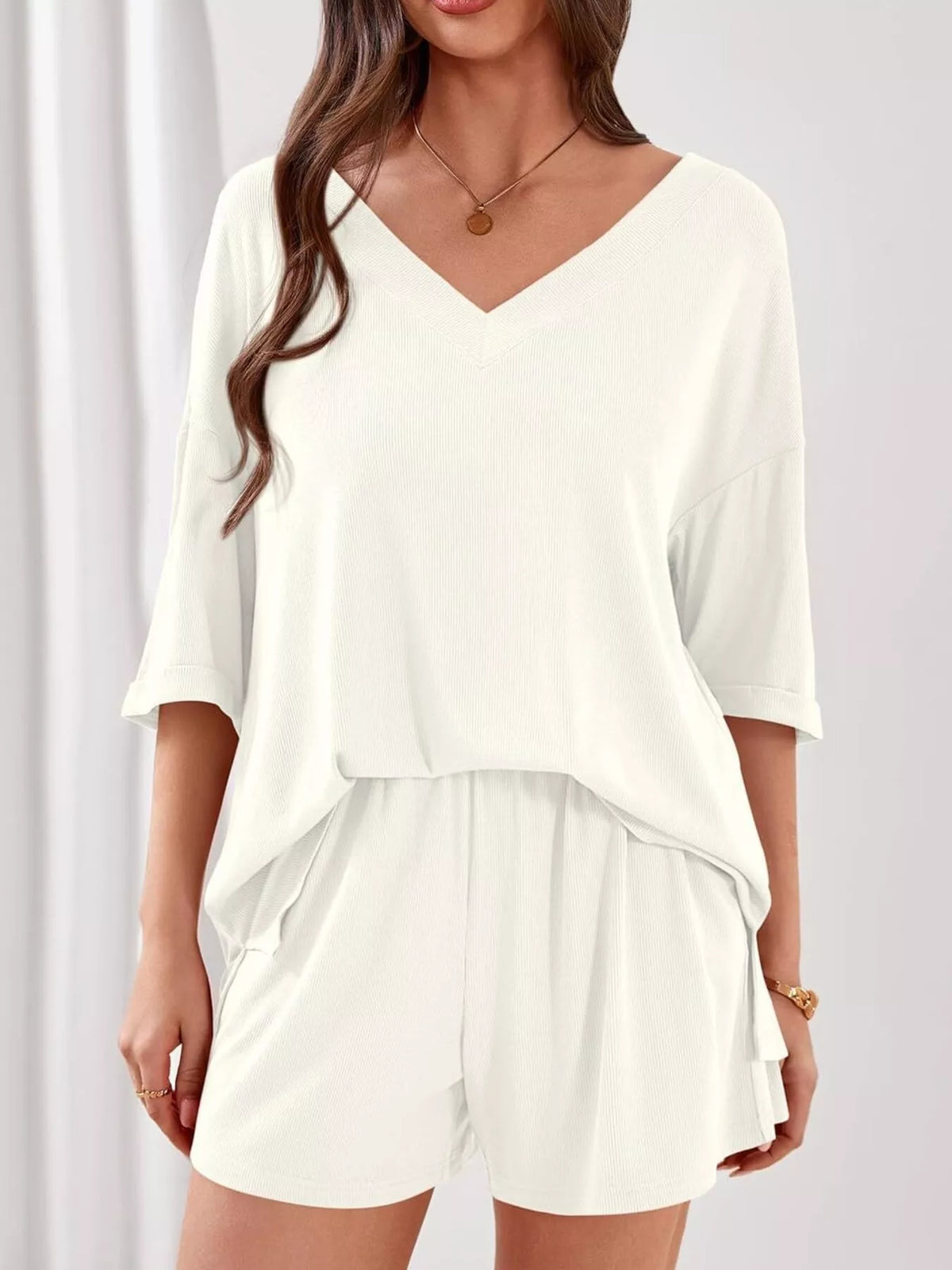 Women's casual V-neck top and shorts two-piece clothing set by Plush Fashion Hub, solid color, comfortable and stylish summer outfit.