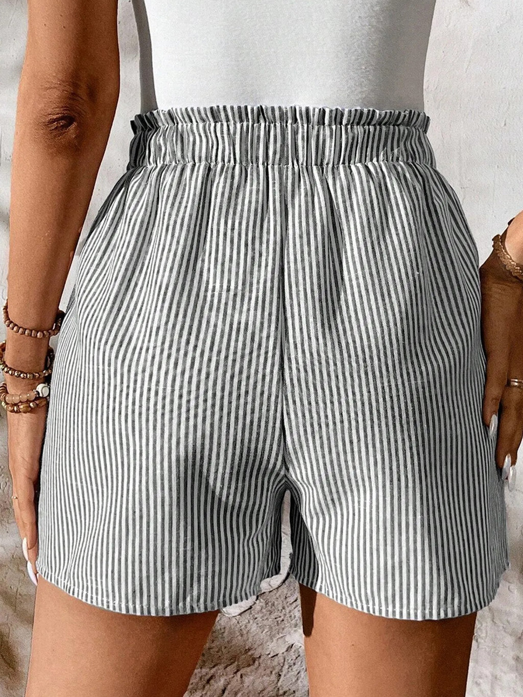 Women's striped elastic waist drawstring shorts from Trendsi, casual summer beachwear with comfortable fit and stylish design.