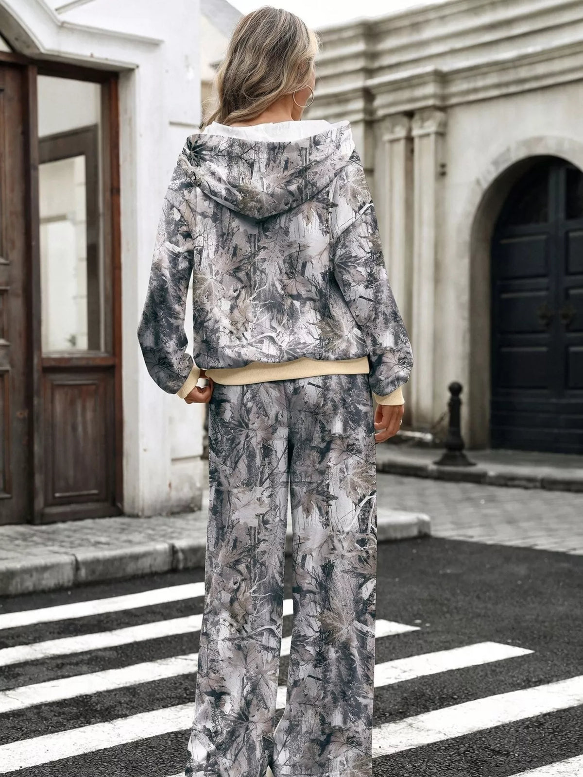 Printed long sleeve hoodie and pants set by Trendsi, featuring a comfortable matching casual outfit with vibrant print details.