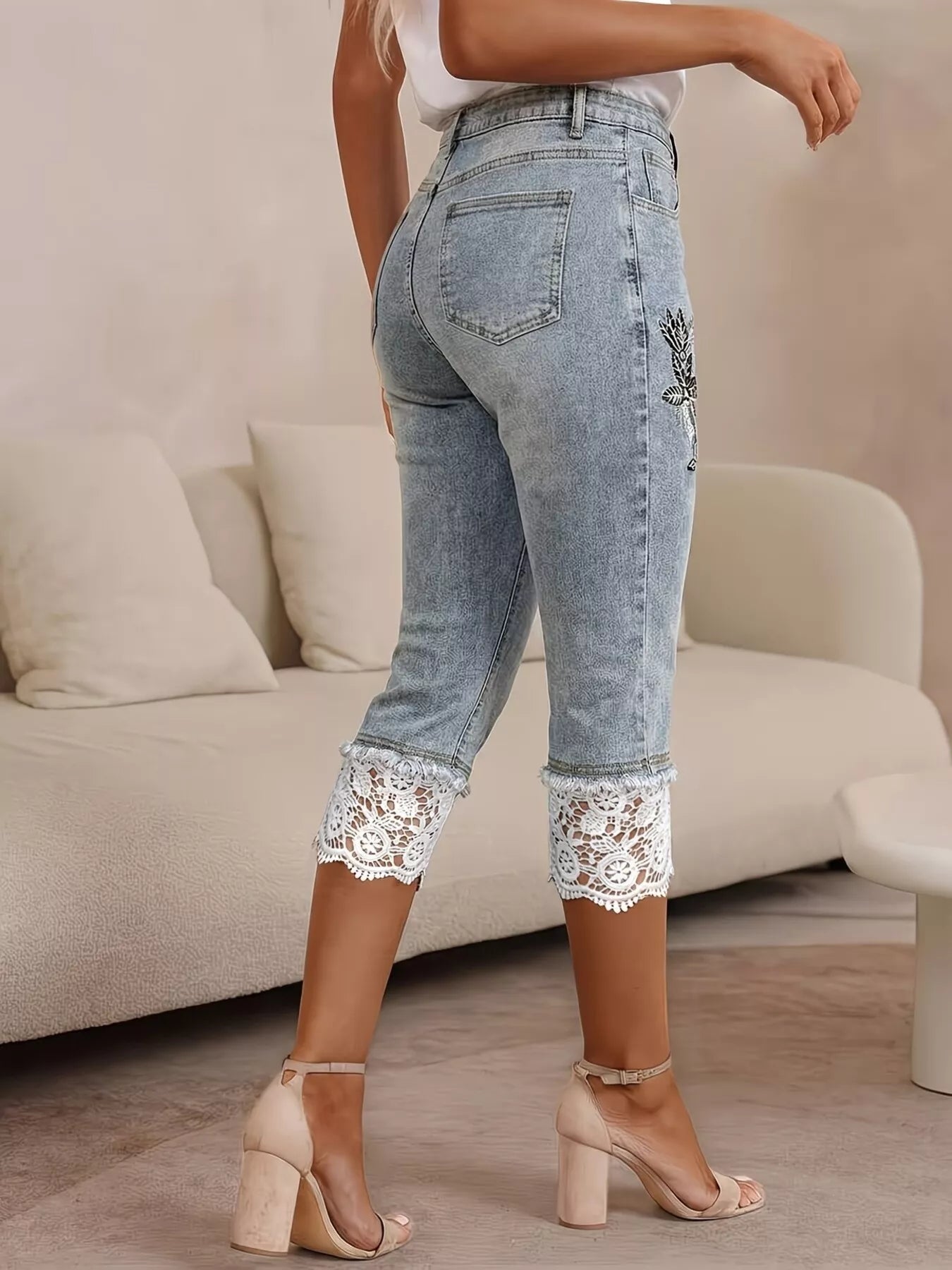 Lace trimmed Capri jeans from Shopimist featuring a classic denim fit and delicate lace accents at the hem.