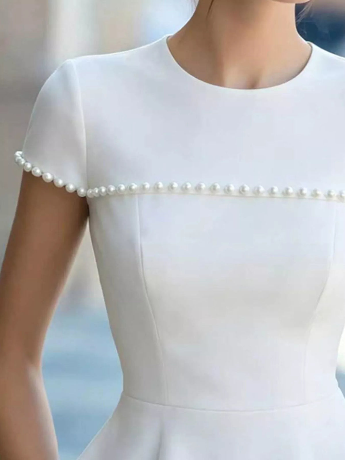 Pearl embellished peplum T-shirt from Plush Fashion Hub, stylish tops with decorative pearl details and a fitted peplum design.