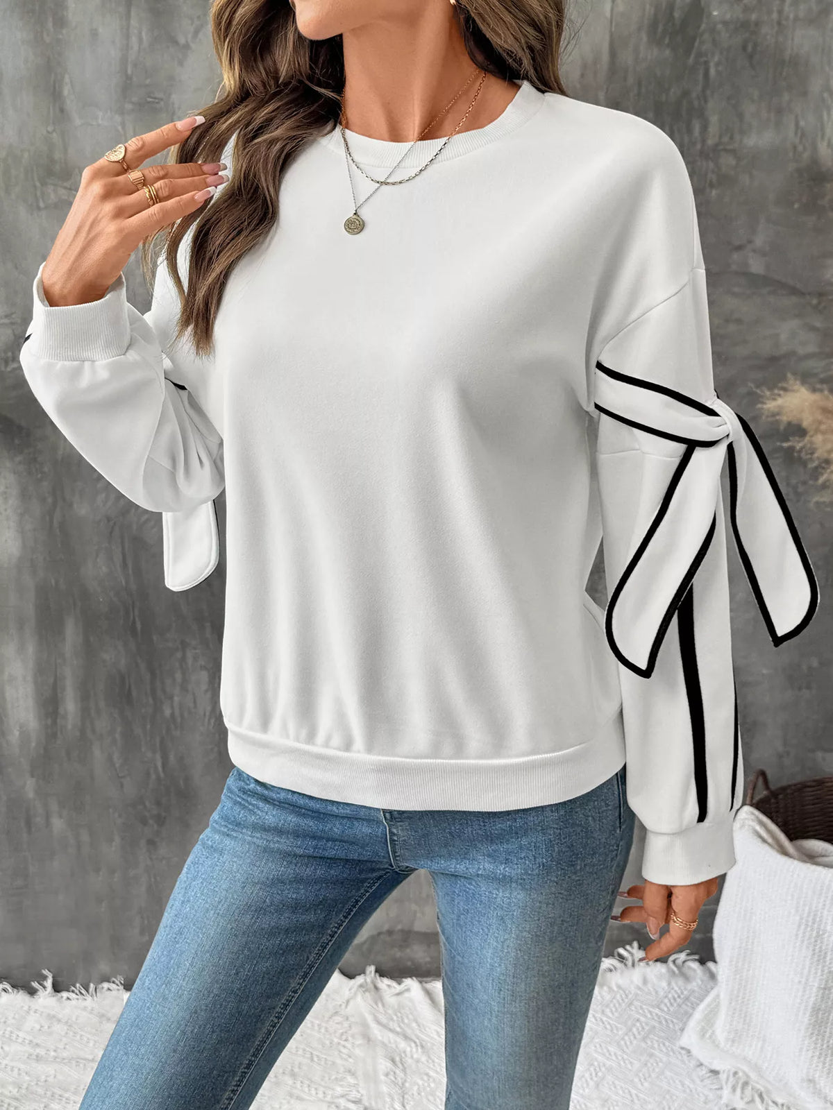 Gray round neck sweatshirt with side stripes from Plush Fashion Hub, casual top with long sleeves and ribbed cuffs.