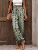 Printed high-waist pants from Trendsi featuring a tied design, stylish and comfortable high-waisted trousers for casual or trendy outfits.