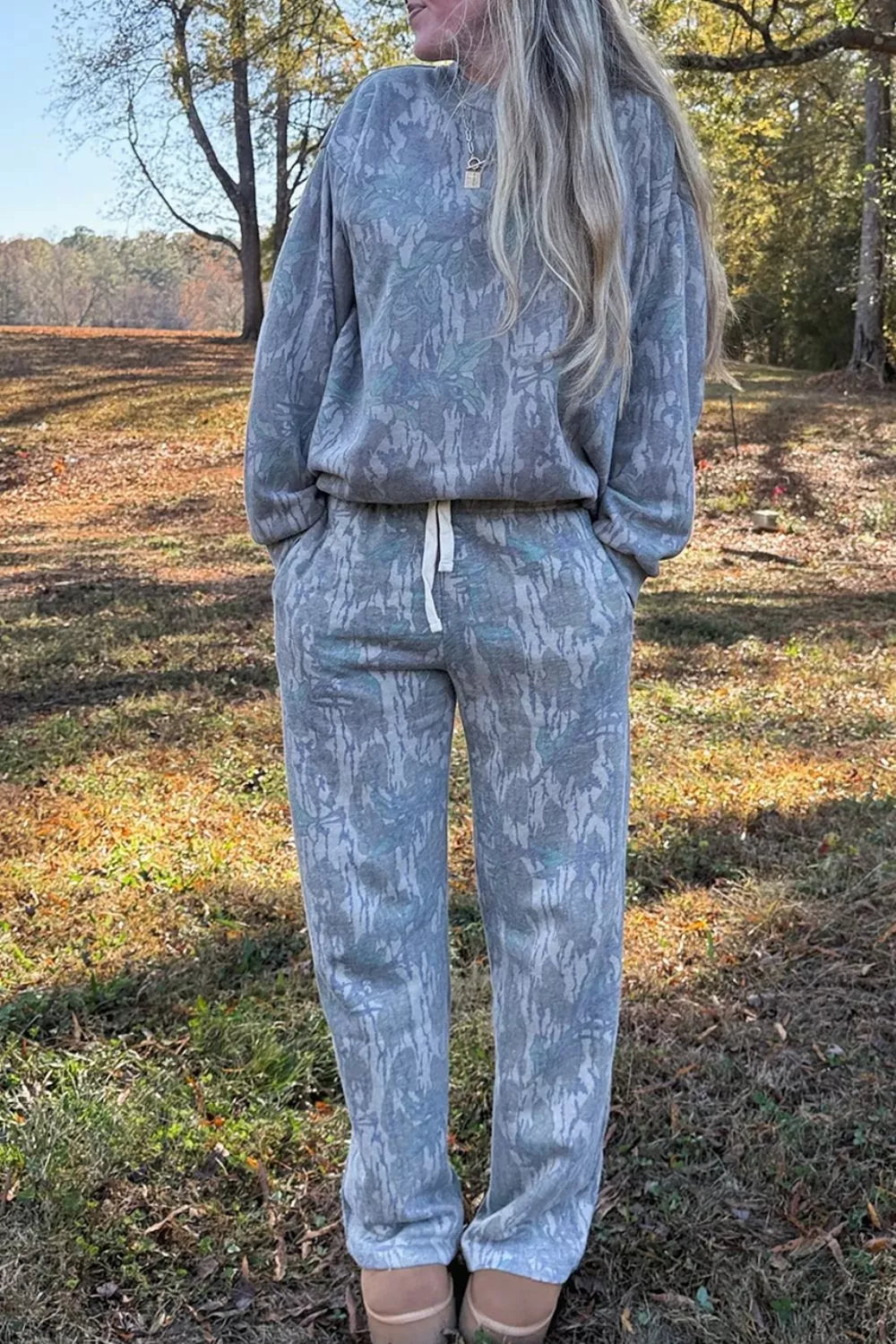 Multicolour abstract botanical print top and drawstring pants set by Trendsi, featuring a vibrant, artistic design and comfortable fit.