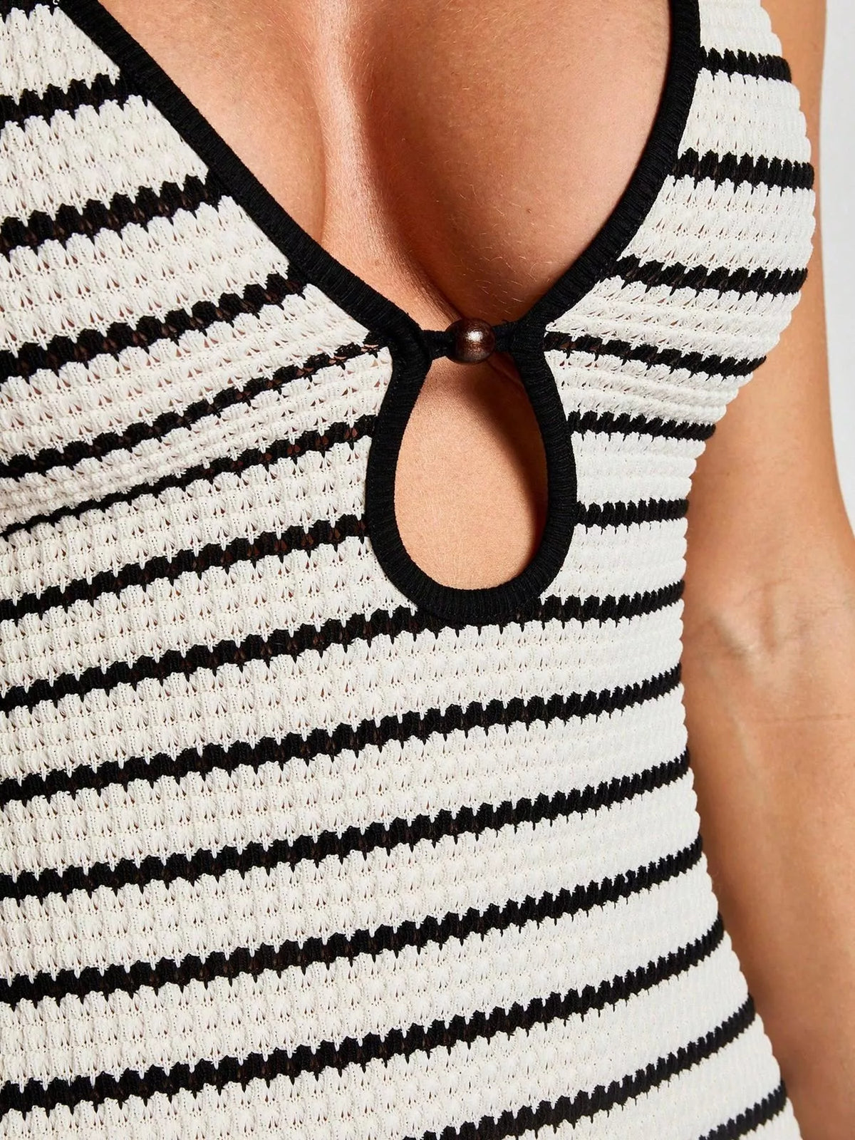 Striped halter neck maxi dress from Plush Fashion Hub showing a flowy, colorful design with a fitted halter top and long length.