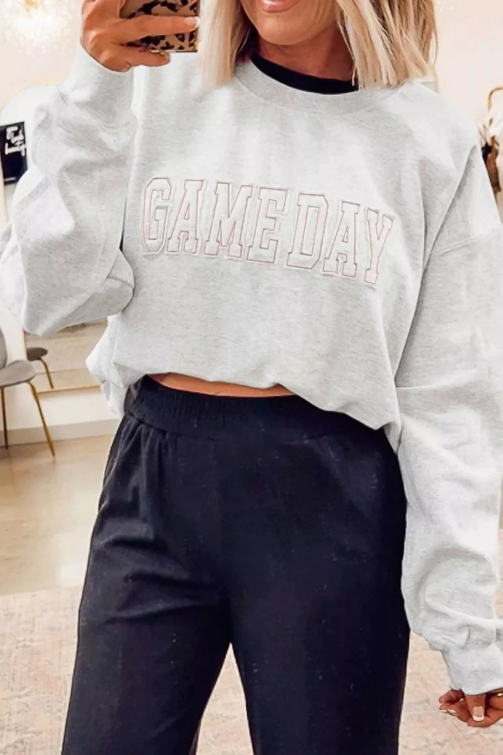 Women's long sleeve sweatshirt with letter embroidery and round neck, by Trendsi, in a casual, comfortable style.