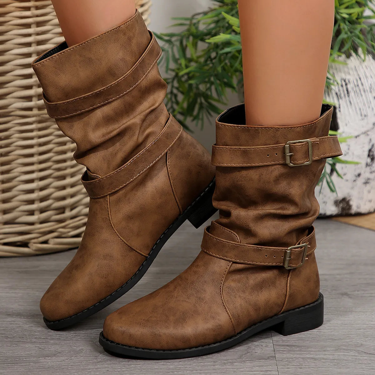 Mid-calf buckle strap boots from Trendsi featuring stylish design, stacked heels, and adjustable buckle straps for a trendy look.