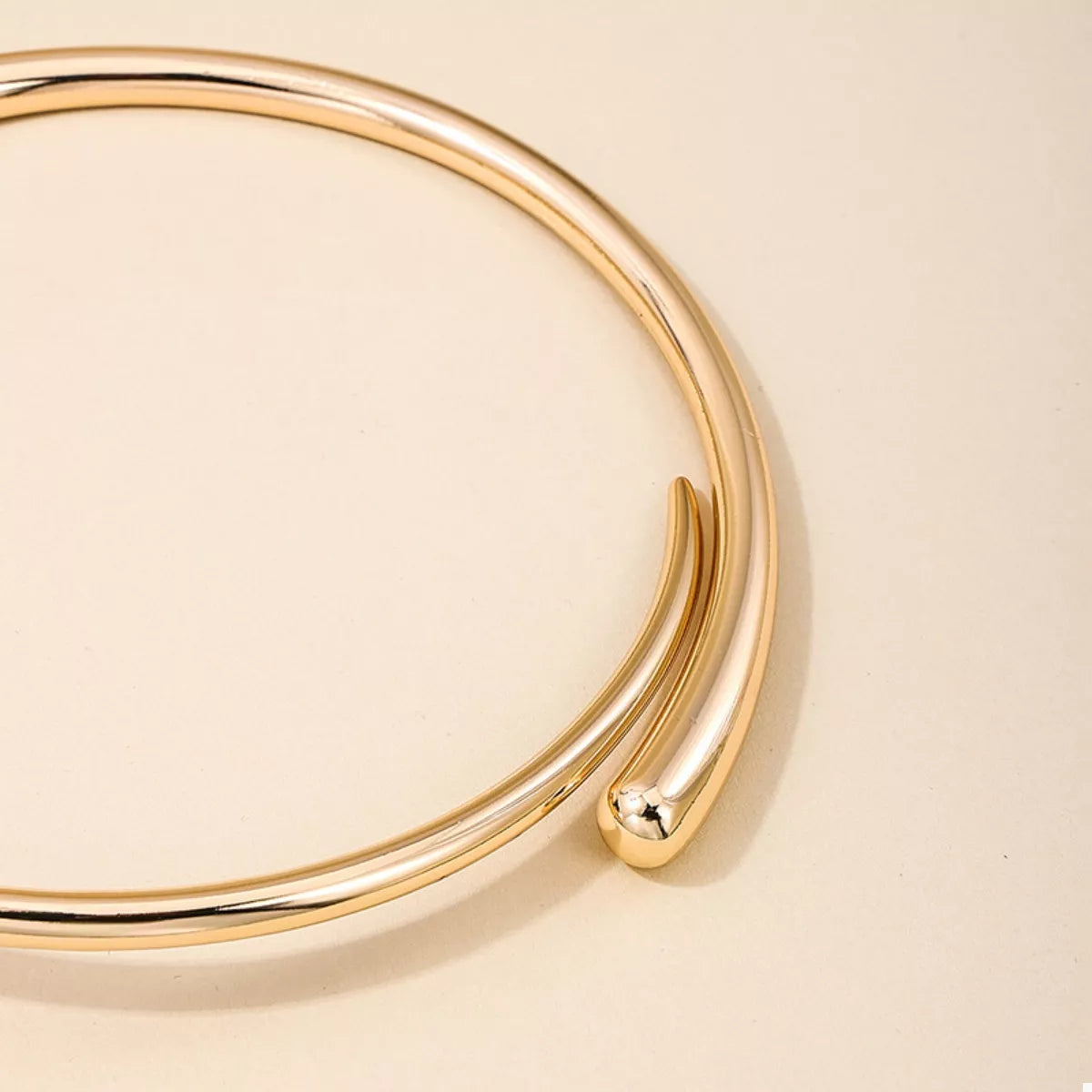 18K gold-plated alloy adjustable necklace with a delicate chain and minimalist pendant, showcasing elegant jewelry design.