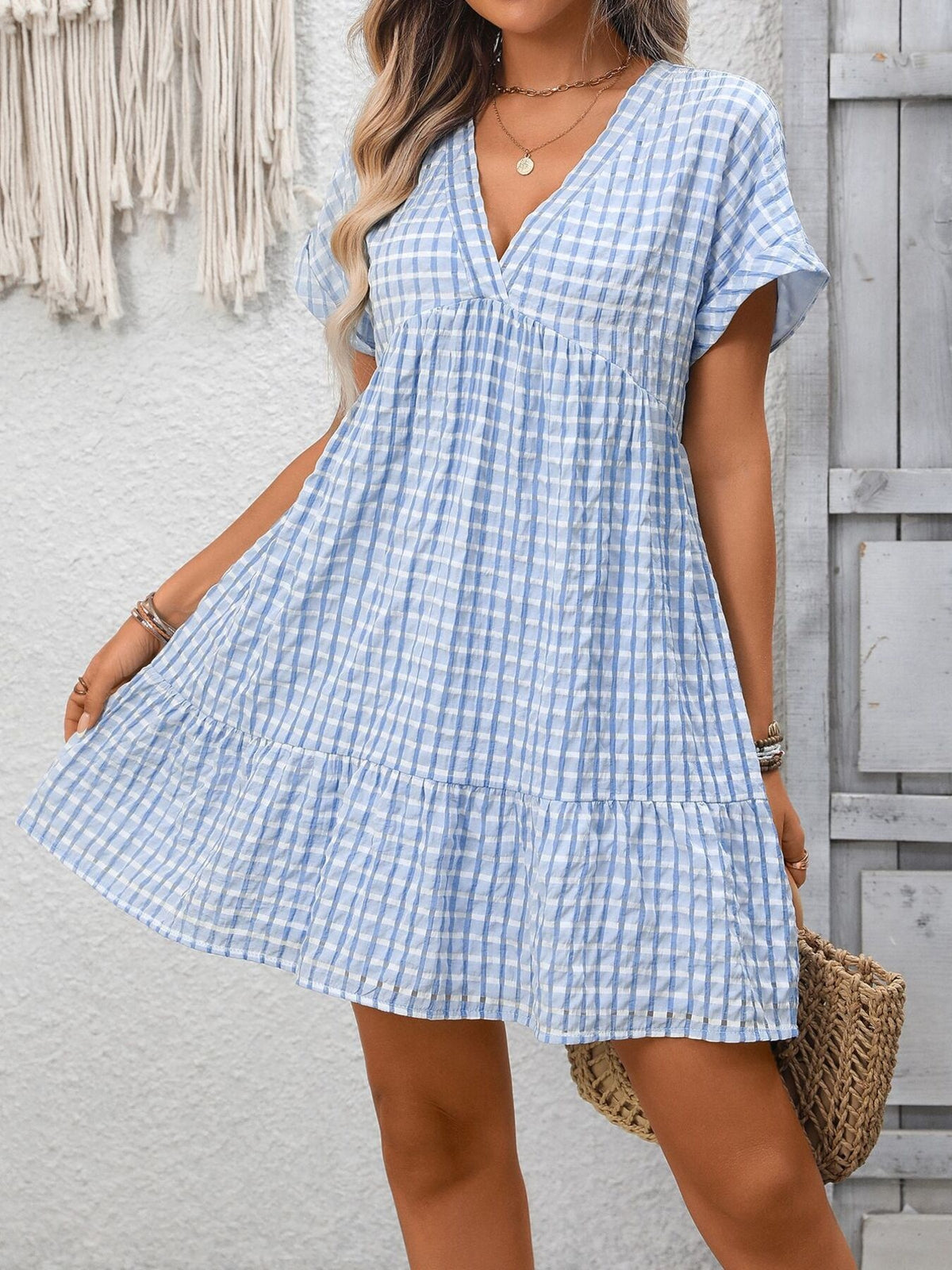 Plush Fashion Hub plaid V-neck mini dress with ruffle hem, stylish and chic for casual or semi-formal occasions.