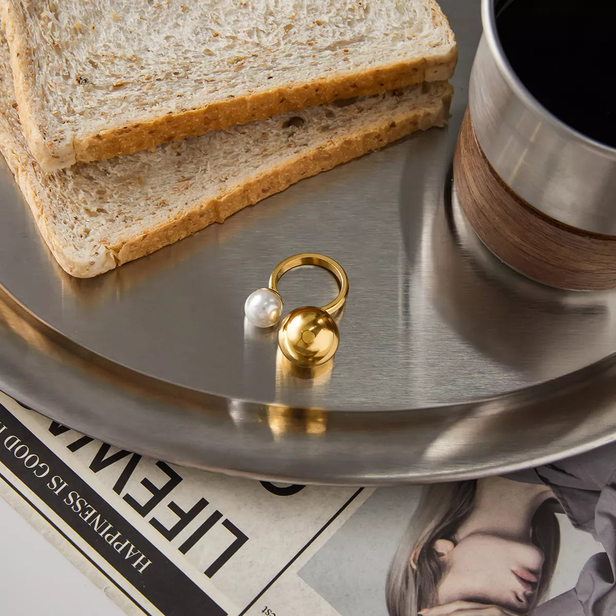 Gold-plated orb and pearl open ring from Plush Fashion Hub, showcasing a sleek design with a shiny gold finish and a central pearl.