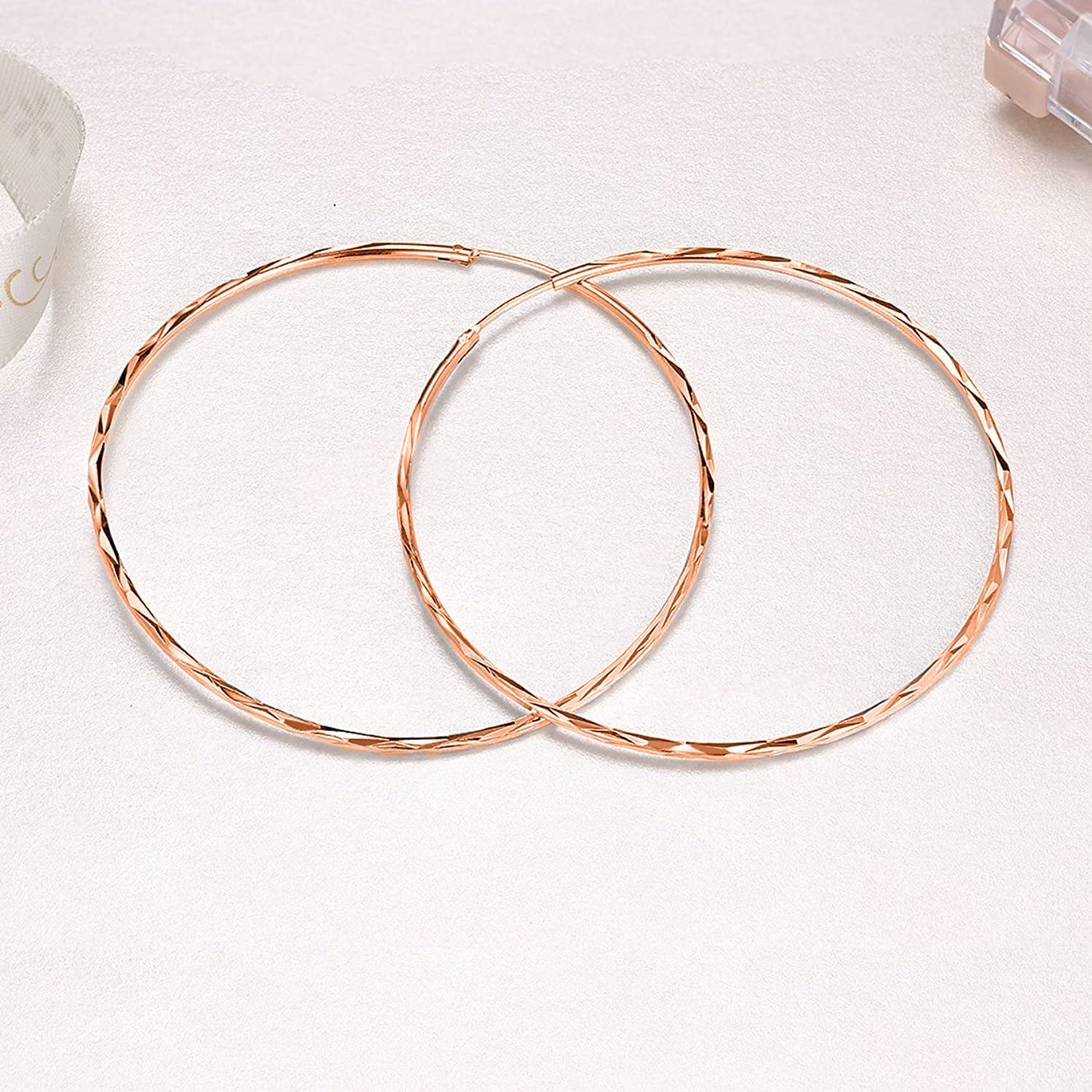 Sterling silver circle endless hoop earrings for women, stylish jewelry gift featuring polished silver hoops.