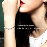 Sterling silver heart zircon bracelet and necklace charm for mother, featuring elegant design and sparkling stones.