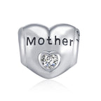 Sterling silver heart zircon bracelet and necklace charm for mothers, featuring a delicate design and sparkling stones.