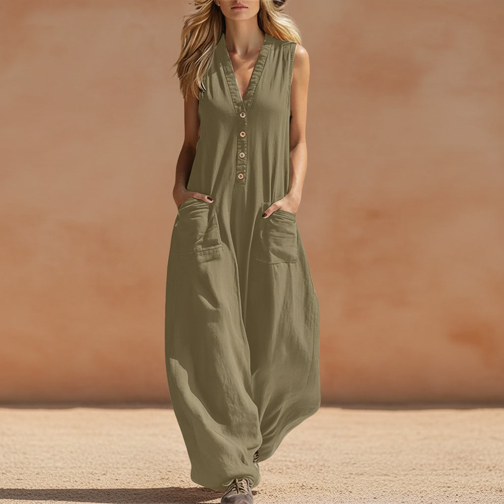 Women's sleeveless wide-leg jumpsuit with pockets from FitiqueFit, casualwear style, shown hanging on a wooden hanger.