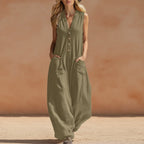 Women's sleeveless wide-leg jumpsuit with pockets from FitiqueFit, casualwear style, shown hanging on a wooden hanger.